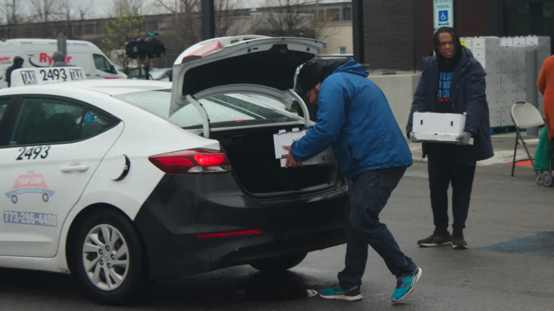 Volunteers with My Block, My Hood My City load food into a car in the parking lot of the Chatham Walmart, 8431 S. Stewart Ave., Sunday afternoon. Credit: Kayleigh Padar//Block Club Chicago