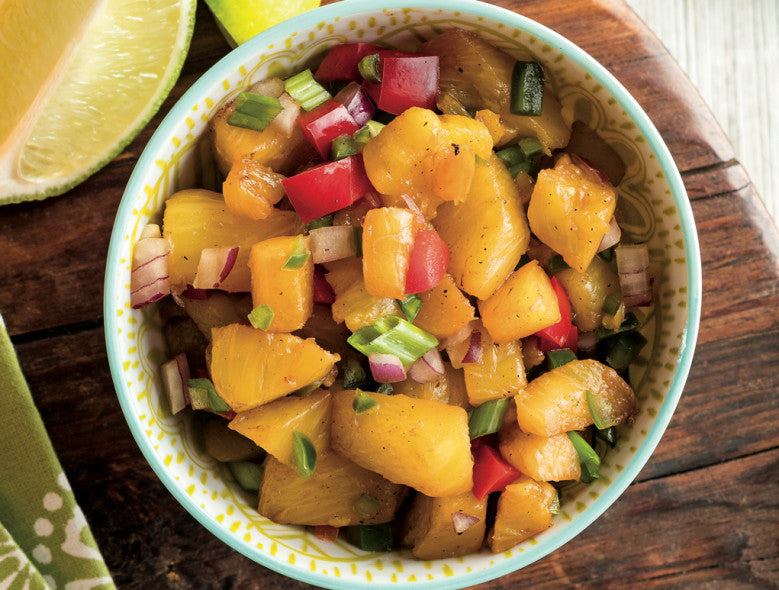 Bowl full of roasted pineapple salsa